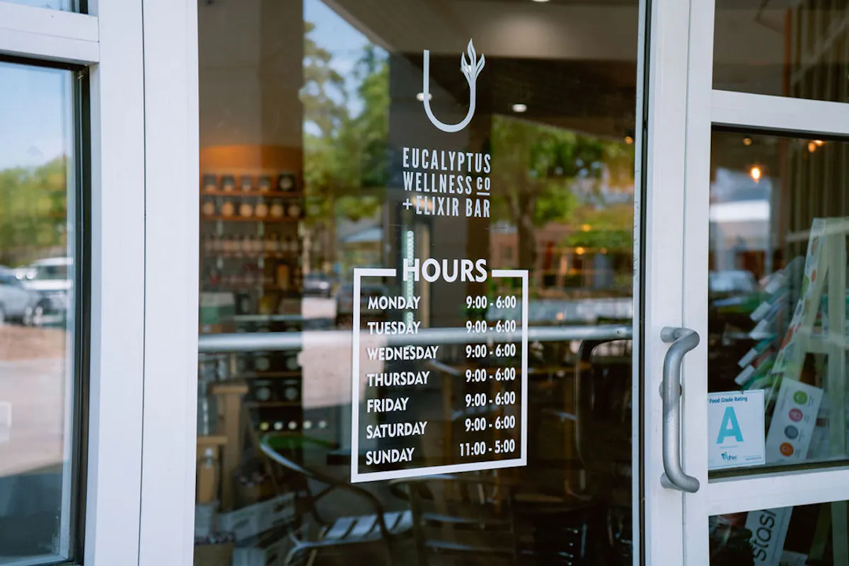 a sign above a store window